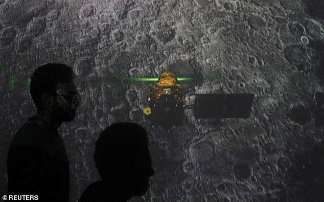 18182938-7435649-image-a-1_1567843682286 Student walk past a screen during a live streaming of Chandrayaan-2 landing at an educational institute in Mumbai, India, September 7, 2019