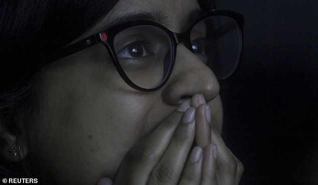18182940-7435649-image-a-2_1567843686681 A student reacts as she watches a live stream of Chandrayaan-2