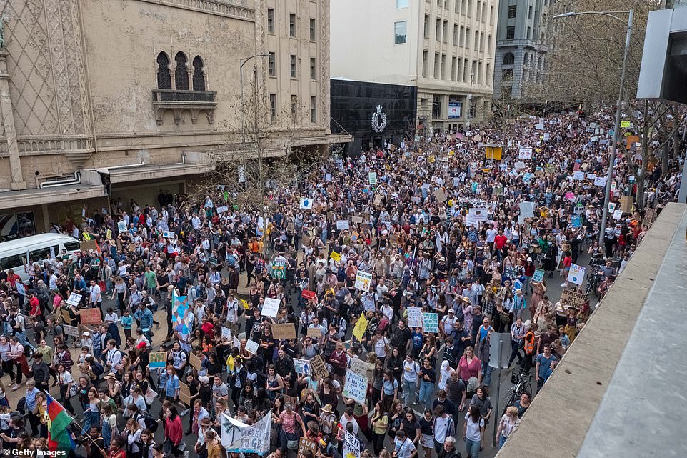 18709566-7484625-image-a-20_1568967716638 More than 100,000 people flooded Melbourne's CBD to fight for action on climate change. Melbourne saw the largest crowds during Friday's mass protests