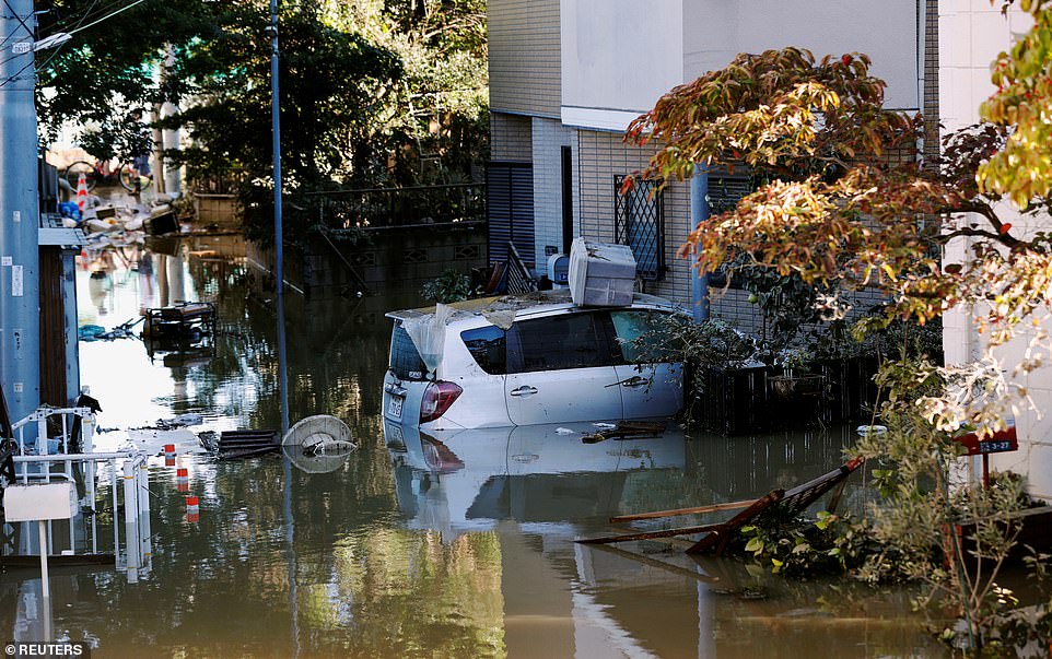 19641682-7567043-image-a-26_1570927898030 The storm claimed the first of two victims hours before arriving on the coast, when strong winds from its outer bands flipped a car in Chiba east of Tokyo and killed the driver