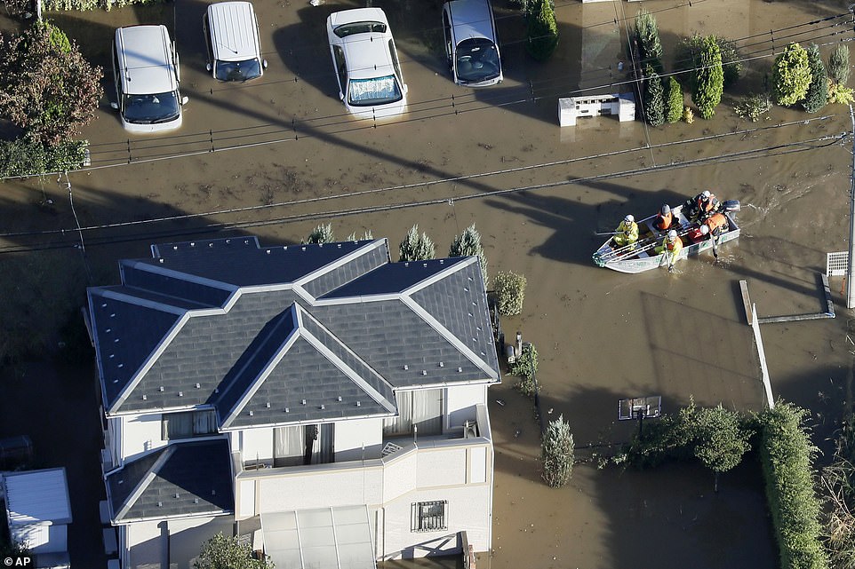 19641684-7567043-image-a-21_1570927793806 At least 26 people are dead and 16 missing after the powerful Typhoon Hagibis ripped through Japan triggering deadly landslides and flooding rivers, with hundreds of homes evacuated