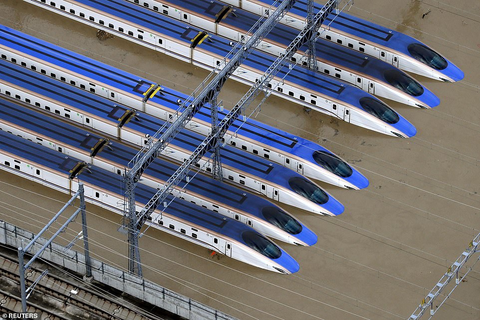 19641800-7567043-image-a-31_1570928092141 A Shinkansen bullet train rail yard is seen flooded due to heavy rains caused by Typhoon Hagibis in Nagano, central Japan