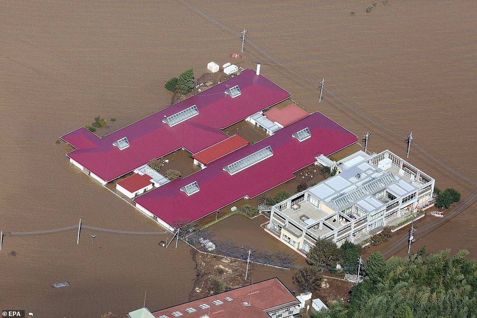 19650598-7567507-image-a-45_1570961763913 A nursing care home is half submerged by deep flood waters in Kawagoe in the Saitama prefecture around 20 miles north of Tokyo