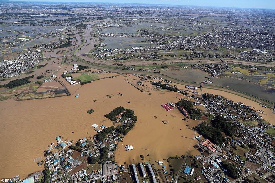 19650602-7567507-image-a-61_1570962360772 An aerial picture shows colossal swathes of territory in Kawagoe, Saitama prefecture, submerged in flood waters on Sunday