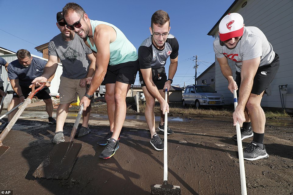 19680334-7570251-image-a-47_1571040944821 Canadian rugby team players volunteered to clean a road in Kamaishi, Iwate prefecture, Japan, following the cancellation of their Rugby World Cup Pool B match against Namibia due to Typhoon Hagibis