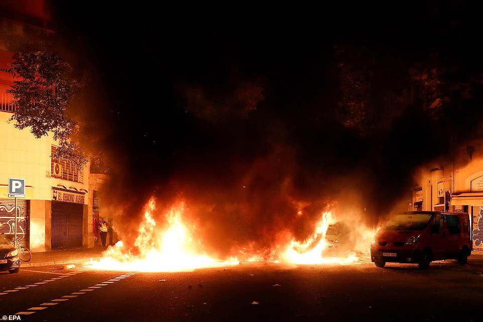 19813556-0-image-a-47_1571269585629 A car is consumed by flames during riots against the Spanish Supreme Court's ruling of multiple jail terms for pro-independence leaders, in Barcelona