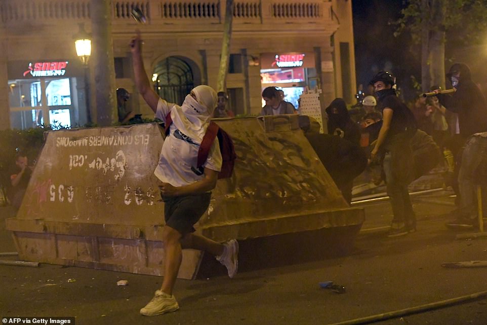 19813568-0-image-a-88_1571269955974 A spokesman for the regional Mossos d'Esquadra force, one of the two police forces combating the violence, even claimed that acid was thrown at officers by protesters