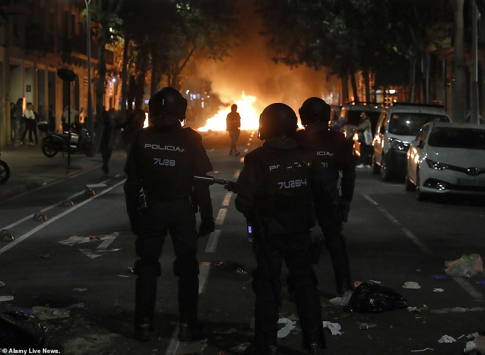 19813628-0-image-a-61_1571269644332 Spanish national police members during a protest against the Spanish Supreme Court's ruling of multiple jail terms for pro-independence leaders, in Barcelona