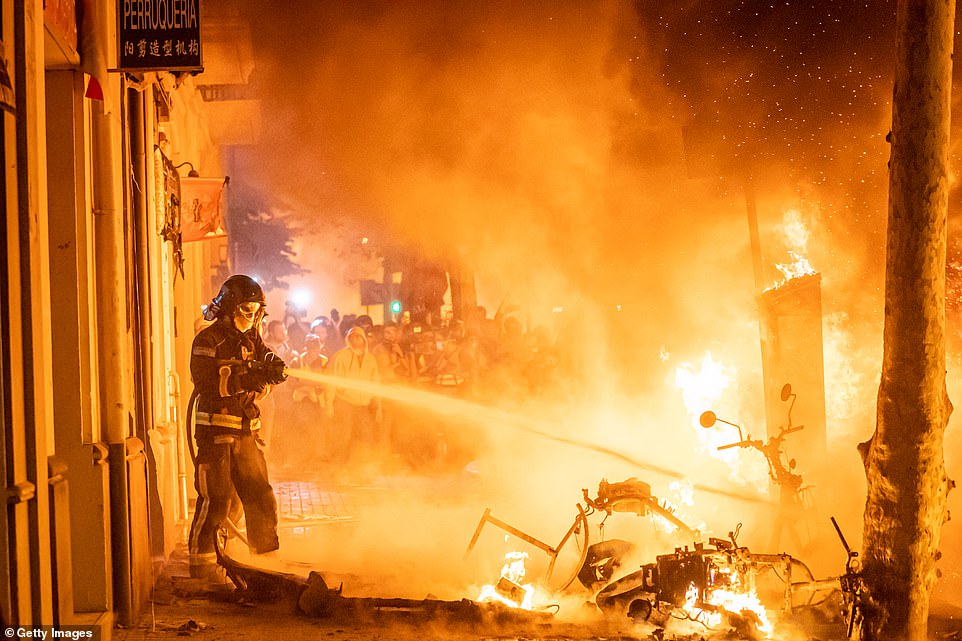 19815238-7581995-image-a-140_1571272343417 Barcelona firefighters put out fires during another night of bad-tempered, violent protests in the city on Wednesday, October 16