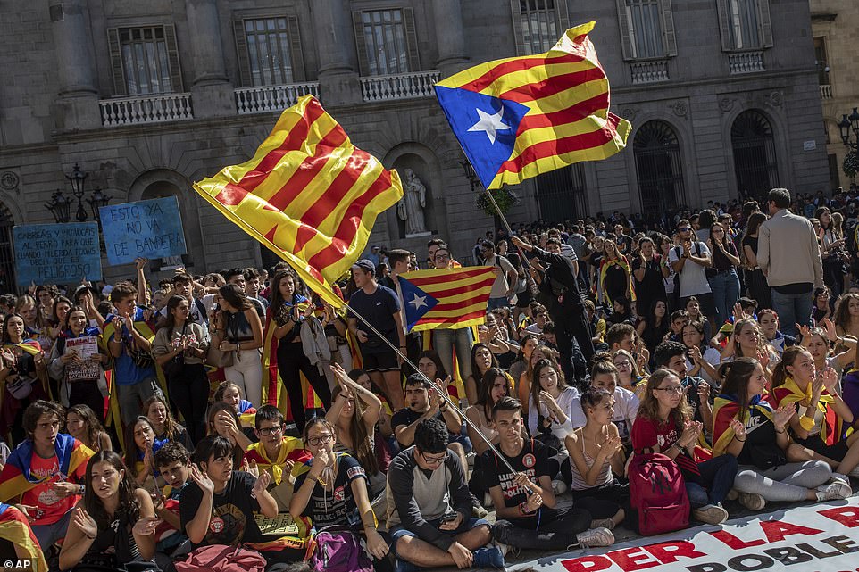 19845654-7584681-image-a-23_1571326716082 Student protesters and their supporters gather in Sant Jaume Square, in Barcelona, outside the City Hall. The embattled northeastern region has been grappling with a wave of protests since a Supreme Court decision on Monday saw nine separatist leaders jailed