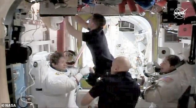 19901830-7588111-image-a-30_1571429578157 Astronauts Christina Koch (right) and Jessica Meir (left) making their reentry to the ISS after completing the first-ever all-women space walk