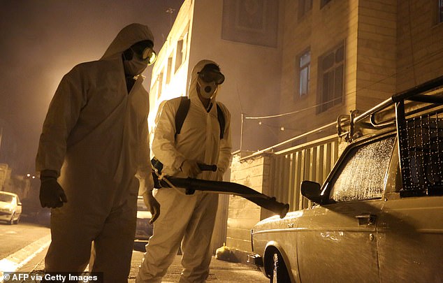 25831774-8099925-image-a-23_1583928951975 Iranian firefighters disinfect the streets of Tehran to halt the spread of the coronavirus today