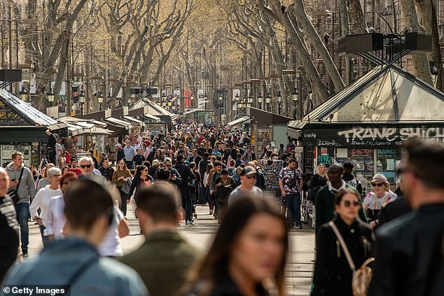 25891358-8105339-image-a-37_1584027449218 Barcelona's Las Ramblas remained busy on March 12, but tourism has been drastically affected by the deadly coronavirus outbreak