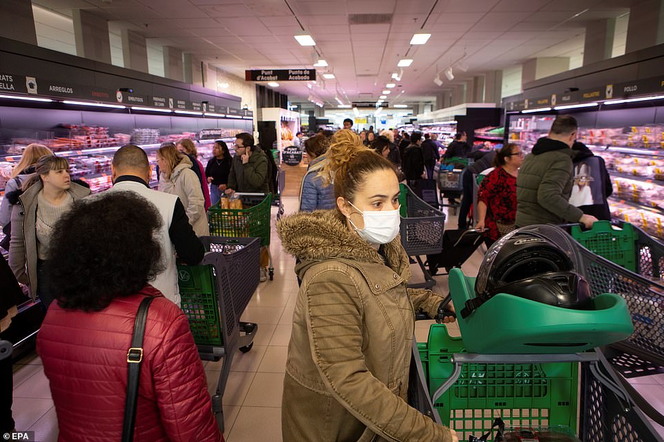 25965006-8111805-image-a-80_1584185209288 Panicked shoppers in Barcelona frantically stocked up on supplies after the government declared the entire country was under a state of emergency