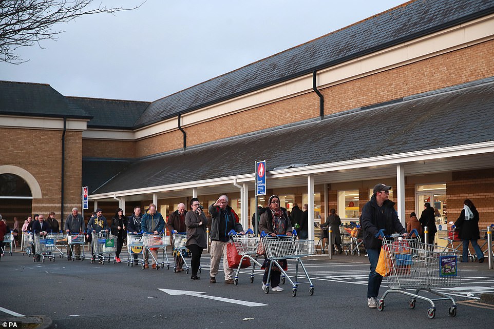 26236138-8137409-image-a-43_1584787108844 People queuing up outside Tescos in Aldershot, a day after the Chancellor unveiled an emergency package aimed at protecting workers' jobs and wages as they face hardship in the fight against the coronavirus pandemic