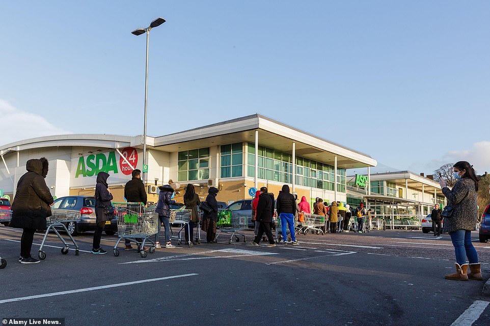 26236188-8137409-image-a-55_1584787275086 More indignant shoppers continue to queue up outside an Asda in Middlesex despite warnings from the government that such behaviour will leave vulnerable customers unable to buy essentials