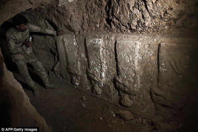 The inscriptions describe Esarhaddon as 'king of the world', and claim he rebuilt the ancient cities of Babylon and Esagil during his reign. This image shows another archaeological find in the ISIS tunnels, which archaeologists have been exploring since January 2017