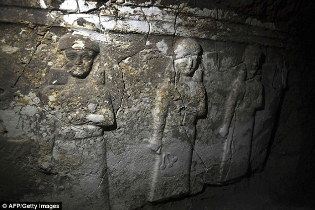 Seven clay tablets, found in a palace hidden under the Tomb of Jonah in the northern city of Mosul, describe the rule of an Assyrian king named Esarhaddon. The demi-goddess sculptures pictured were carved into the walls of the palace over 2,000 years ago