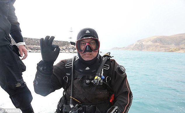 4670aeb600000578-0-image-m-8_1510935964842 Experts had been studying the body of water for a decade before it revealed the fortress lost deep below its surface. This image shows a member of the research team after the find