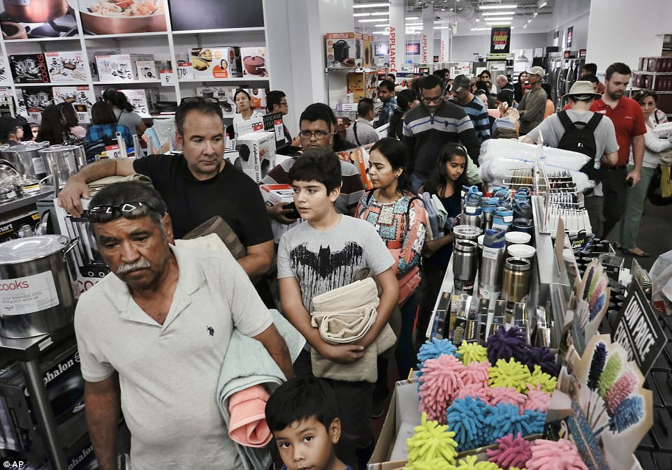CALIFORNIA: Thanksgiving holiday shoppers wait in a check out line at the JCPenny store in Glendale, California on Thanksgiving Day