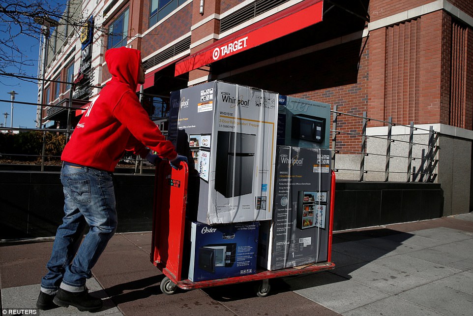 BROOKLYN: A man pushes a cart of refrigerators and microwaves in to Target store 