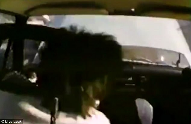 Despite crashing into the back of a stationary vehicle at a high speed, the driver appear to be unscathed 
