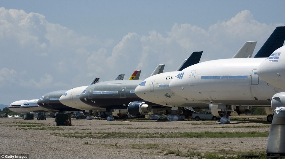 Commercial airplanes lie next to one another in Marana, Arizona. More than 50 clients use the storage facility