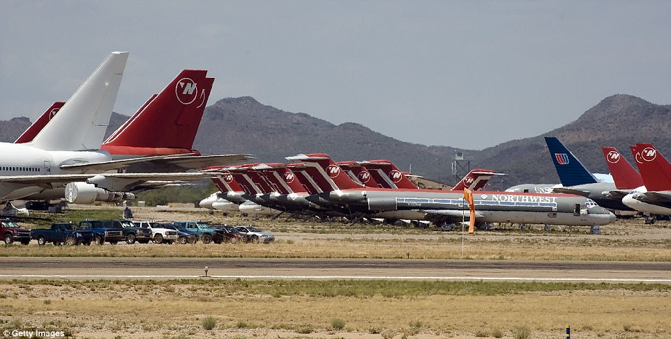 A line of Northwest Airlines planes are parked at a storage ramp at the Evergreen Air Center in Marana, Arizona