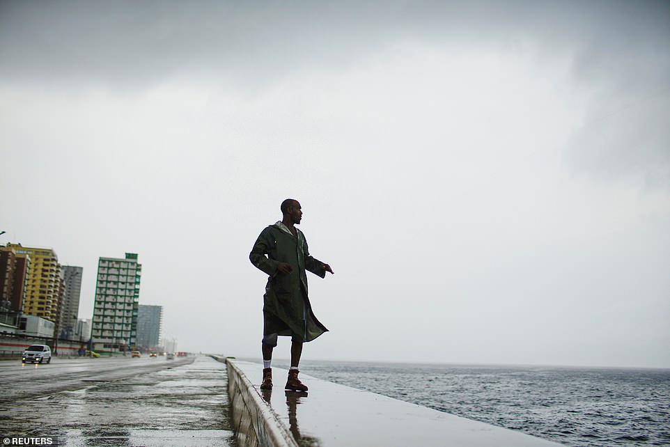 4875992-6255093-alexander_charnicharo_fishes_at_the_seafront_in_havana_as_hurric-a-17_1539061936868 Alexander Charnicharo fishes at the seafront in Havana as Hurricane Michael passes by western Cuba on Monday