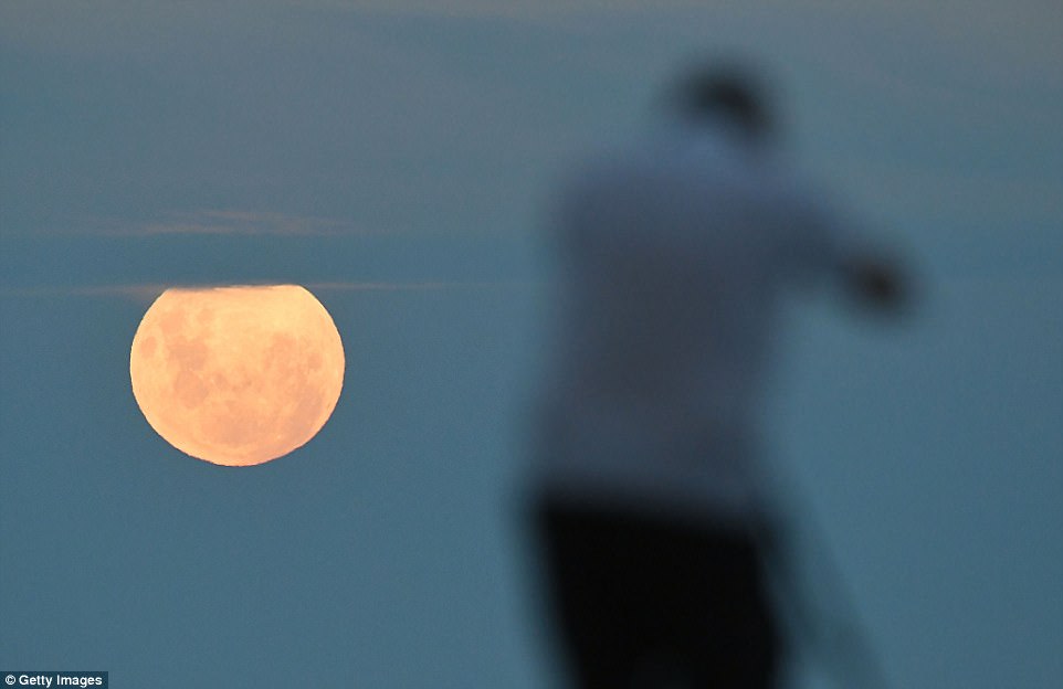 The full eclipse is at 2:07pm UTC (2:07pm GMT, 9:07am ET) although some of it will still be visible after that. The last time the spectacle was seen was in 1866, 152 years ago. Pictured is the full moon above the Marine Parade Beach in New Zealand