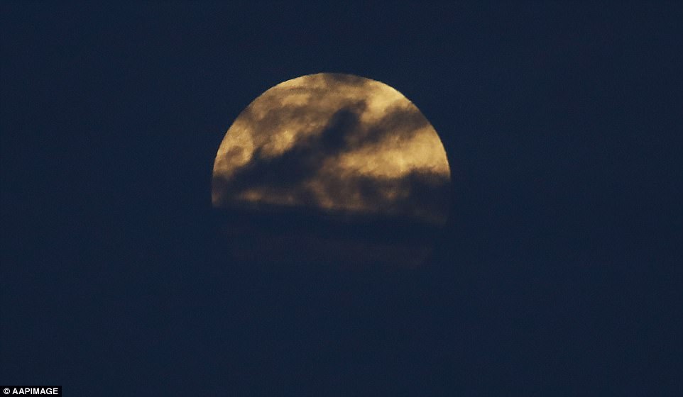 The moon entered the earth core shadow at 11.48 GMT (6:48 ET) so we can already see some red, Dr Daniel Brown, an astronomy expert from Nottingham Trent University, told MailOnline. The moon rises near Bondi beach in Sydney hours before the full lunar eclipse