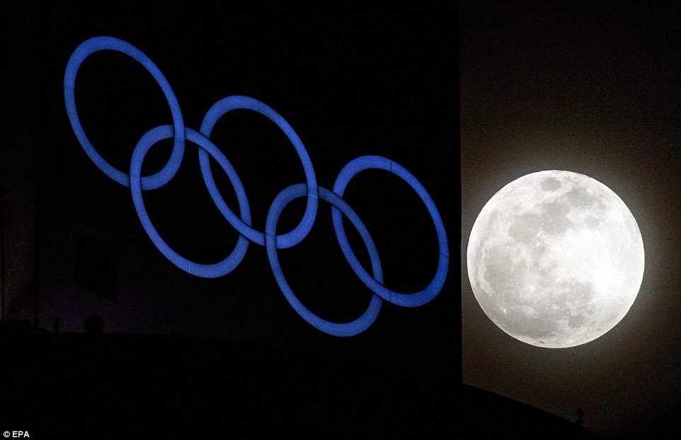 A so-called 'Supermoon' rises above the Olympic rings installation at the Alpensia Ski Jumping Center of the PyeongChang Winter Olympic Games 2018