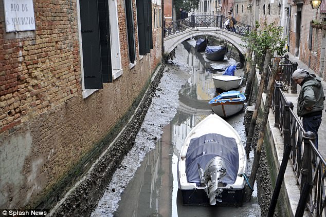 Unusual weather has left some of Venice's legendary canals dried out - forcing gondolas to park up on dry land