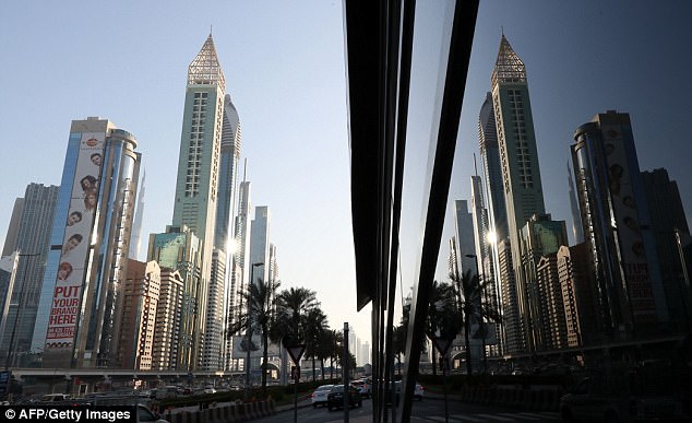 The gleaming gold 75-storey Gevora Hotel towers above the Dubai skyline, standing at 1,168 feet (356 metres), or nearly a quarter of a mile, tall