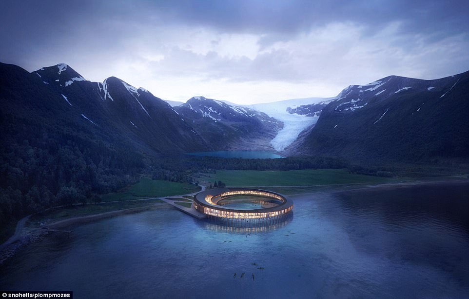 Scheduled for a 2021 opening, hotel Svart will sit in a breathtaking location at the foot of Svartisen - Norway's second largest glacier. Pictured above, a computer rendering showing an aerial view of the finished design