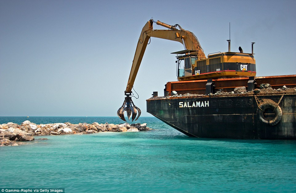 An estimated $14 billion was sunk into the project as millions of tonnes of rock was used to build up a 20-mile break water