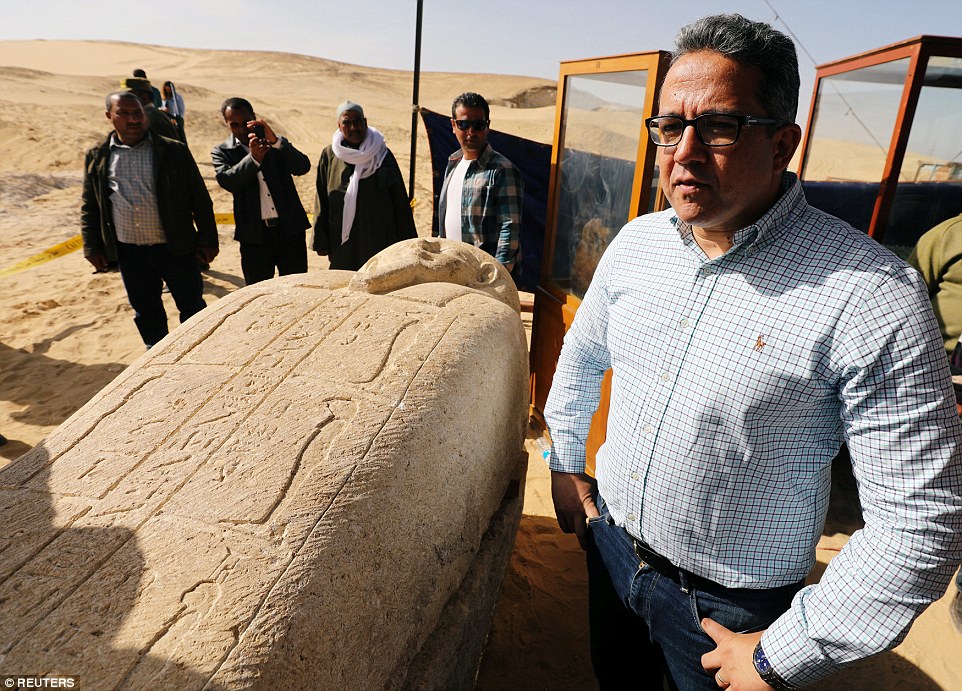 Minister of Antiquities Khaled El Anany stands near a stone sarcophagi, discovered in an ancient burial site in Minya,