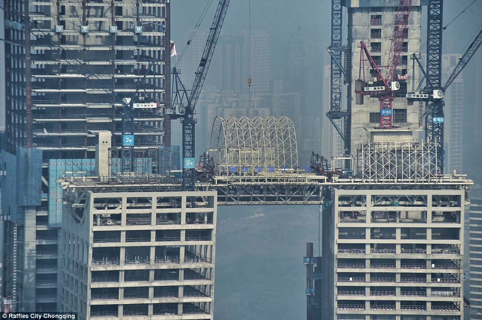 49f797b700000578-5469297-image-a-28_1520439029090 Workers have built the corridor in nine segments, including three that were built on the ground then hoisted up to the top