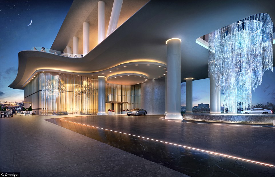 The lobby area of the Dorchester Collection's new Dubai premises looks ultra-chic, with an impressive chandelier, spotlights and grand columns 