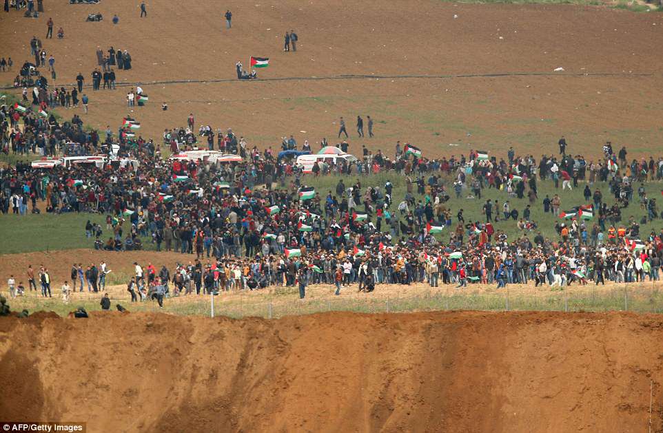 A picture taken  from the southern Israeli kibbutz of Nahal Oz across the border from the Gaza strip shows  some of the participants in the  tent city protest commemorating Land Day