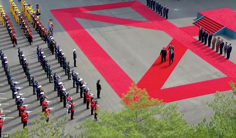 Kim was greeted by Moon at 9.30am local time (8.30pm EST/12.30am GMT) before the pair walked together through Panmunjom accompanied by a military band playing Korean folk songs