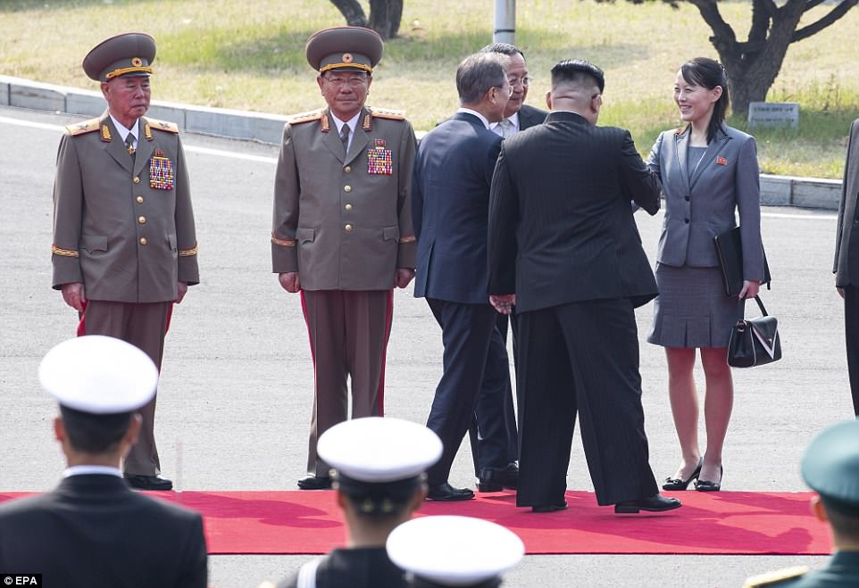Meet and greet: South Korean President Moon Jae-in is introduced to Kim's sister Kim Yo-jong as officials watch on