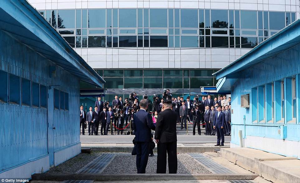 South Korean President Moon Jae-in (left) and North Korean Leader Kim Jong Un (right) shake hands on meeting for the Inter-Korean Summit at the military demarcation line