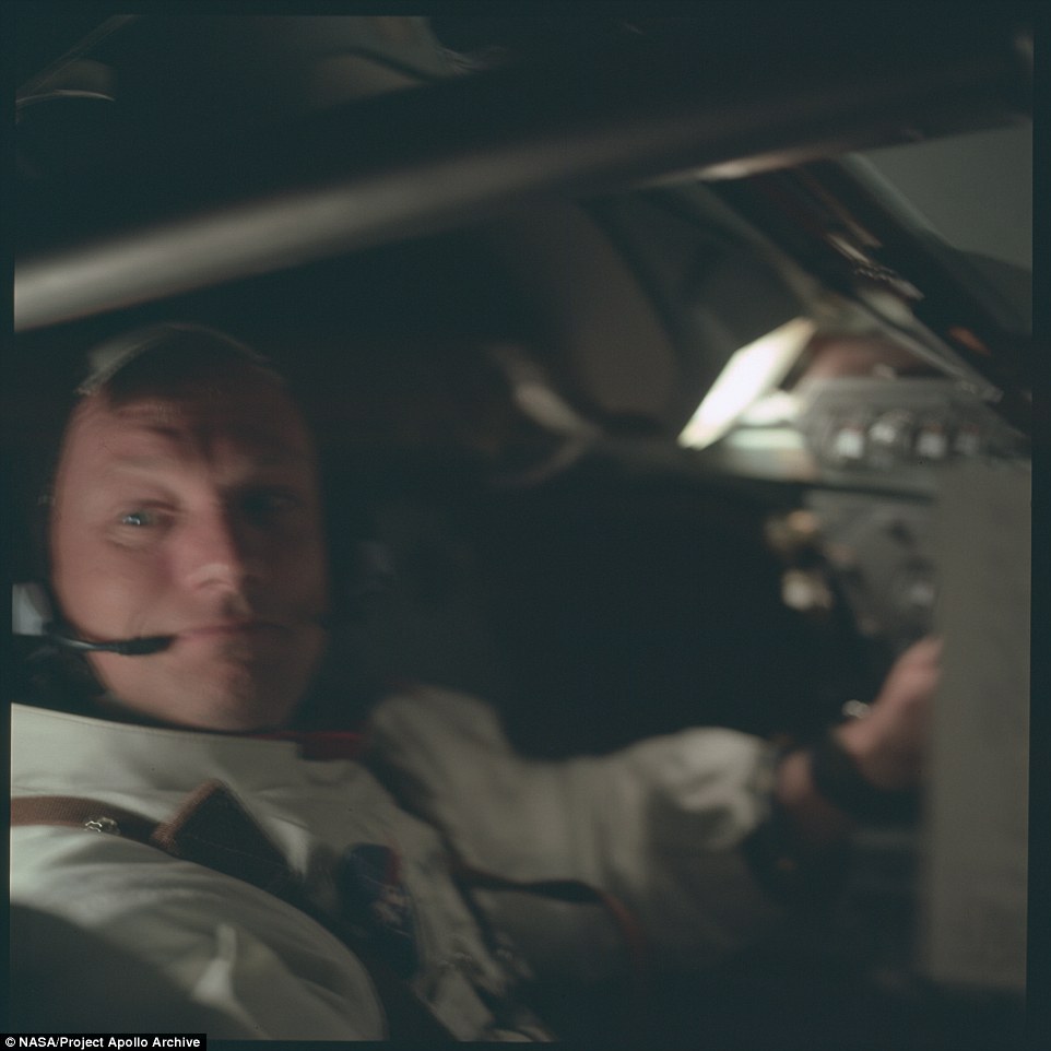 An almost-smiling Neil Armstrong is seen in the Lunar Module as he and Aldrin make their way to the lunar surface