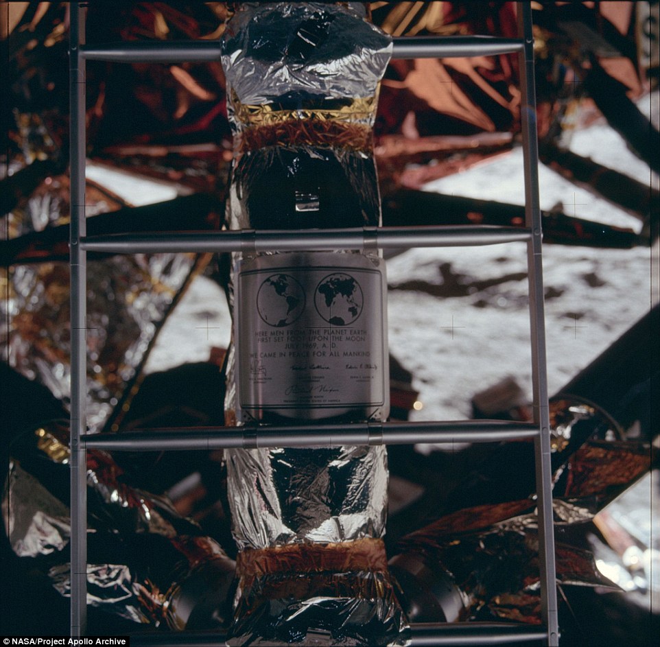 A close-up of the plaque left behind the astronauts, which reads: 'Here men from the planet Earth first set foot upon the Moon July 1969, A.D. We came in peace for all mankind' along with the signatures of the astronauts and President Richard Nixon