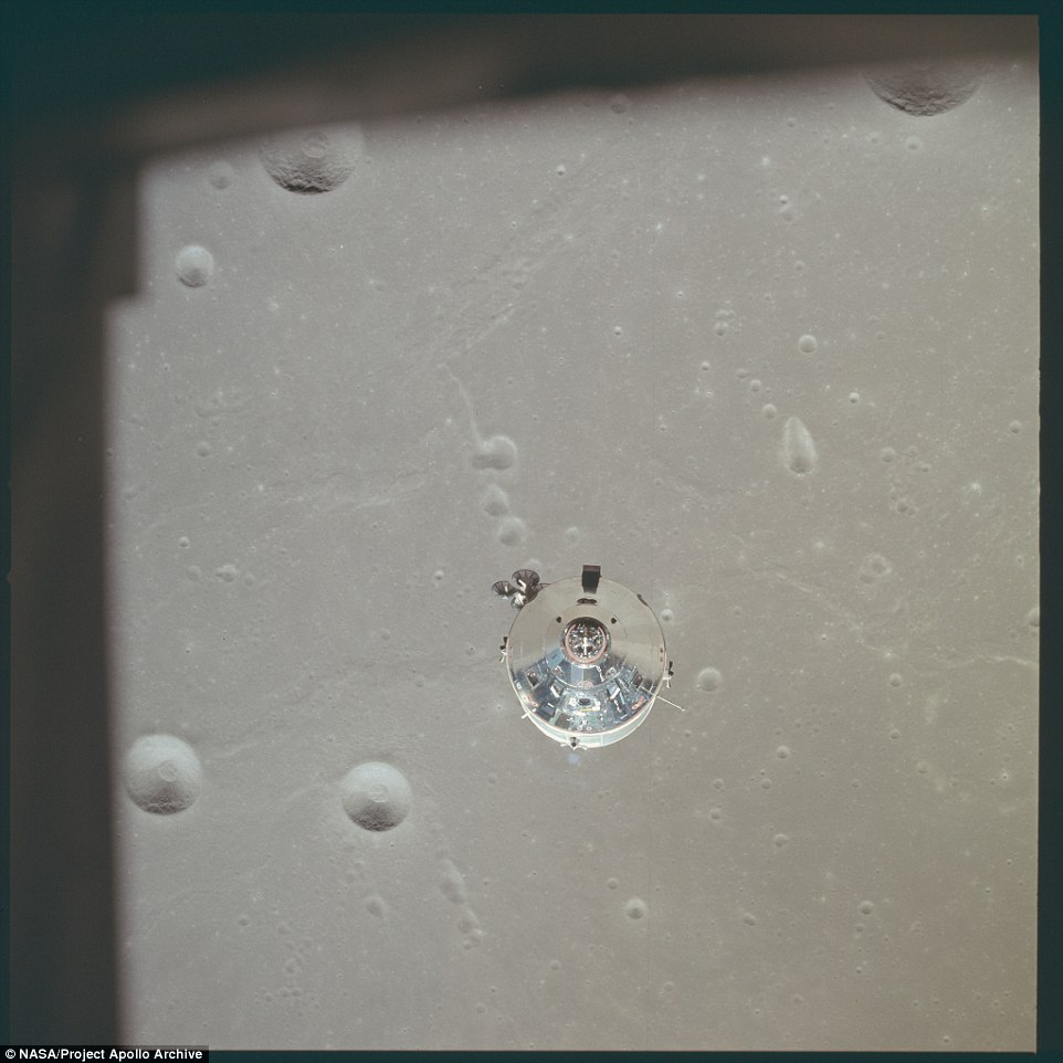 The command module is seen from the lunar model in this photo taken from above