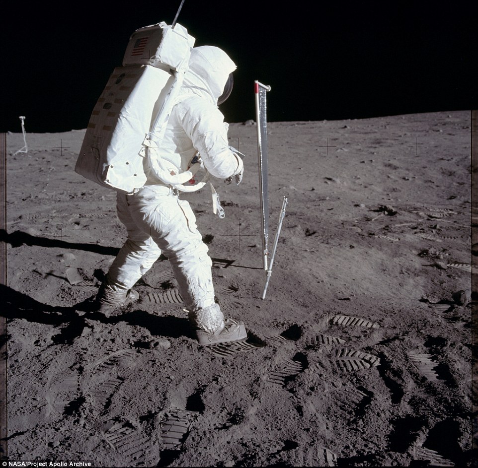 Aldrin conducts experiments on the moon. The astronauts brought home 50 rocks, samples of lunar soil and tubes containing material dug as far as 13 centimeters below surface of the moon