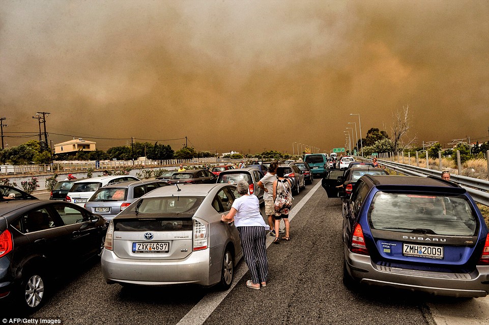 Huge traffic jams formed as holidaymakers and residents took to the roads with the flames closing in on the Kineta area