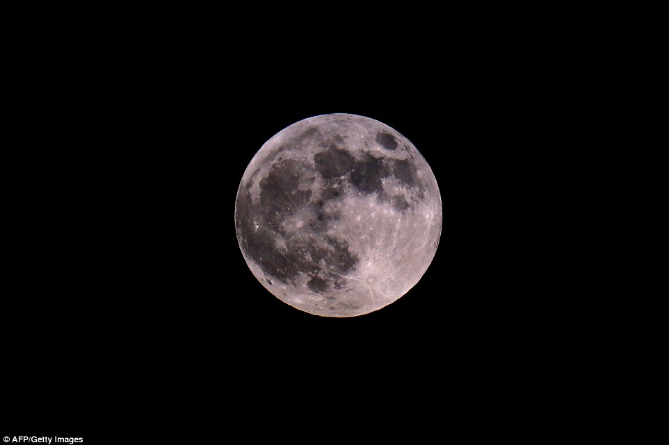Pink moon: The Blood Moon shines a pale pink over Netanya, Israel as the longest lunar eclipse in the next 100 years happens