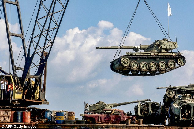 Tanks are placed in the sea in order to allow algae to flourish in the hope that it will restore the natural marine life 
